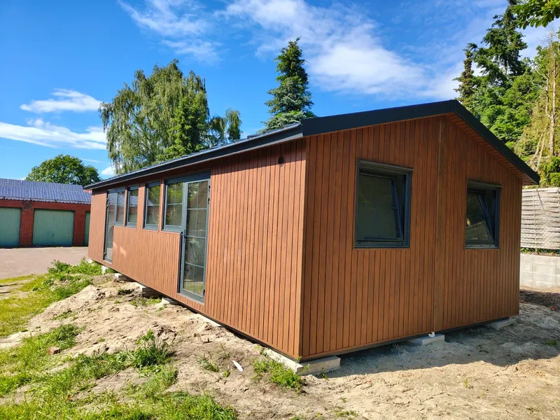 Residential module with timber facade on a slope