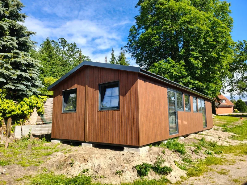 Residential module with timber facade and pitched roof